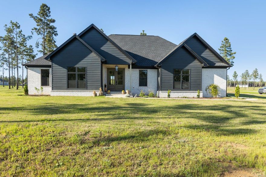 Welcome to your own piece of paradise on 3 acres of beautiful land in a highly desirable neighborhood. This custom built home, crafted just 3 years ago, is filled with unique touches and finishes that will make you feel right at home.  Step inside and cozy up next to the gas fireplace, perfect for those chilly evenings. With 3 bedrooms and 2.5 bathrooms, there is plenty of space for your family to relax and unwind. Need a 4th bedroom or office? The possibilities are endless in this space.  The outdoor living space is a true oasis, featuring a Woodburning fireplace where you can gather with loved ones and enjoy the serene surroundings. The large pantry is a chef's dream, and the ample natural lighting throughout the home creates a warm and inviting atmosphere.  Don't miss out on the opportunity to make this charming home yours!