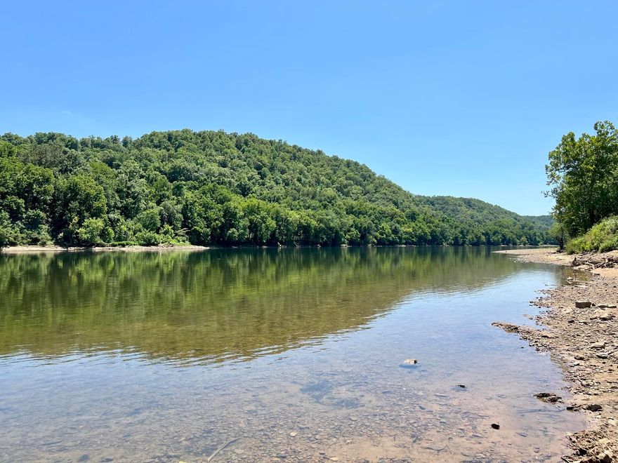 This 1.67 acre tract is located at Reds Landing, outside of city limits. This property's convenient location allows for easy access to recreational activities, with the Arkansas Game and Fish boat launch and river being just a short walking distance away.  Additionally, PJ's Resort is less than a quarter mile from the property, offering potential amenities and entertainment options. This property’s location presents an excellent opportunity for outdoor enthusiasts or those seeking a tranquil retreat. Nestled within this picturesque setting, you'll find a 12x30 Bald Eagle providing a comfortable space to relax after a day on the river. There is electricity already set up on the property.