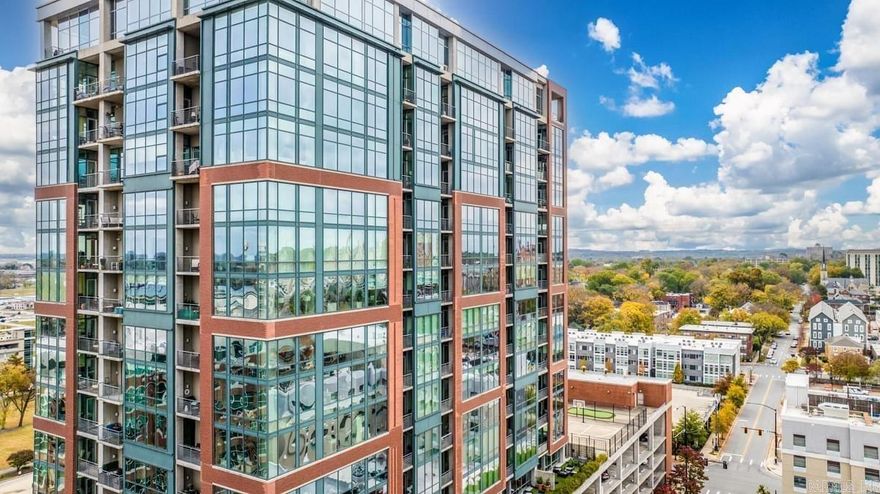 NEW PRICE!!  Fabulous Modern/Industrial Condo in Coveted River Market Tower on the Northeast Corner! Has the largest terrace - Approximately 17' x 30' (561) sq ft + another smaller one off living room by primary bedroom! Loaded out with extras! Like New! Polished Concrete floors, Marble kitchen and bathroom counters. See list on Associate Docs. Walk to everything! Amenities galore! Pool, Grill and entertainment area, dog walk, community garden, pickleball & tennis court! Basketball and chipping/putting green. Wonderful exercise facilities! Concierge available every day! Safe and secure and gated parking, 2 assigned covered parking spaces. Custom Built Fireplace! River Room on 20th Floor is great for family gatherings/ parties or Razorback Games! Nothing like it on the market! Lots of custom features! Ready to move into!     SEE AGENT REMARKS