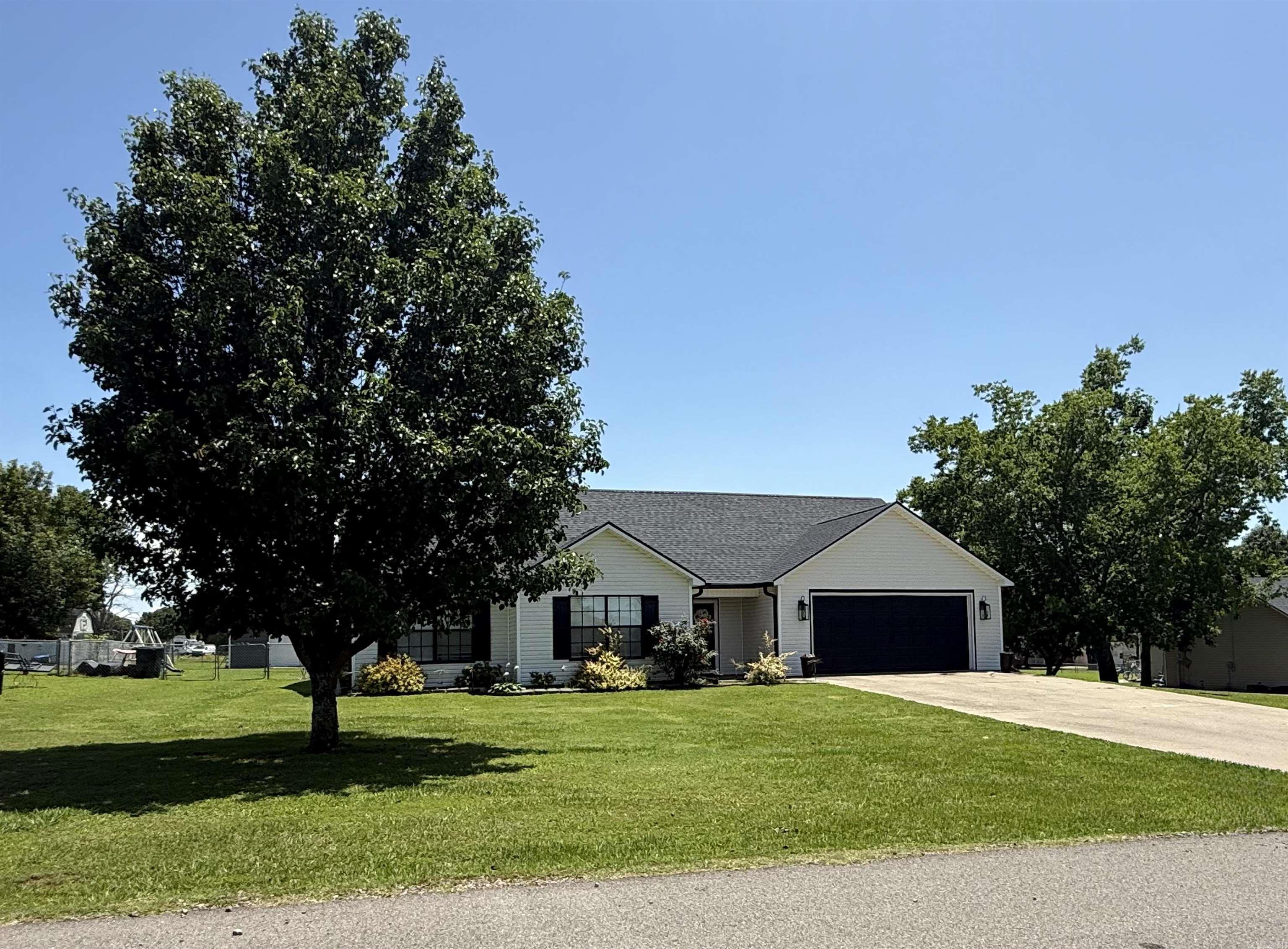 Stunning Home with Spacious Layout - 2914 Hatties Ln, Ozark, AR Check out this gorgeous newly updated home featuring a spacious and open floor plan; located off Highway 64 close to Altus, in Ozark, Arkansas. This home offers 4 bedrooms plus an office/playroom/etc. and is perfect for both work and relaxation. Two of the bedrooms are master suites, each with its own bathroom and ample space and privacy. The heart of the home is its large open floor plan and beautiful kitchen, which includes conveying top-of-the-line KitchenAid appliances. You'll appreciate the large walk-in pantry for all your storage needs, the convenience of walk-in closets, and a large laundry room to make everyday tasks easier. The large backyard is perfect for outdoor entertaining, and it comes with a shop for all your DIY projects and storage needs. With plenty of square footage, there is plenty of room to spread out and make this home your own. This beautiful home also includes beautiful crown molding and new baseboards. It also has been recently updated with new light fixtures, ceiling fans, and bathroom fixtures/mirrors. Don't miss the chance to see this gorgeous home! Schedule a tour today!
