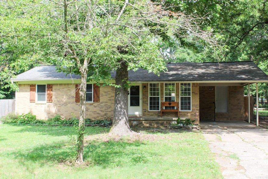 Are you in search of a beautiful new home in Searcy? Look no further! This charming, spacious residence on the west side of Searcy is waiting for you. The master bedroom is a true retreat, featuring an adjoining room that offers endless possibilities. Whether you envision it as a cozy office, a craft room, or a relaxing lounge area, this flexible space is ready to accommodate your lifestyle. Additionally, the master closet includes a storm shelter that is accessible from inside the home. The heart of this home is its inviting open floor plan, seamlessly connecting the kitchen, dining area, and living room. The living room is adorned with a rock fireplace complete with a wood-burning stove. The kitchen is a chef's dream, boasting granite countertops and a large island with seating, perfect for meal preparation and casual dining. Ample storage space ensures that everything you need is within easy reach, making cooking and entertaining a breeze. In the backyard there is a shop with a roll-up door, currently set up as a personal gym. Attached to the shop is a fenced-in area, ideal for pets to roam and play safely. This home truly has it all! Let's go take a look today!