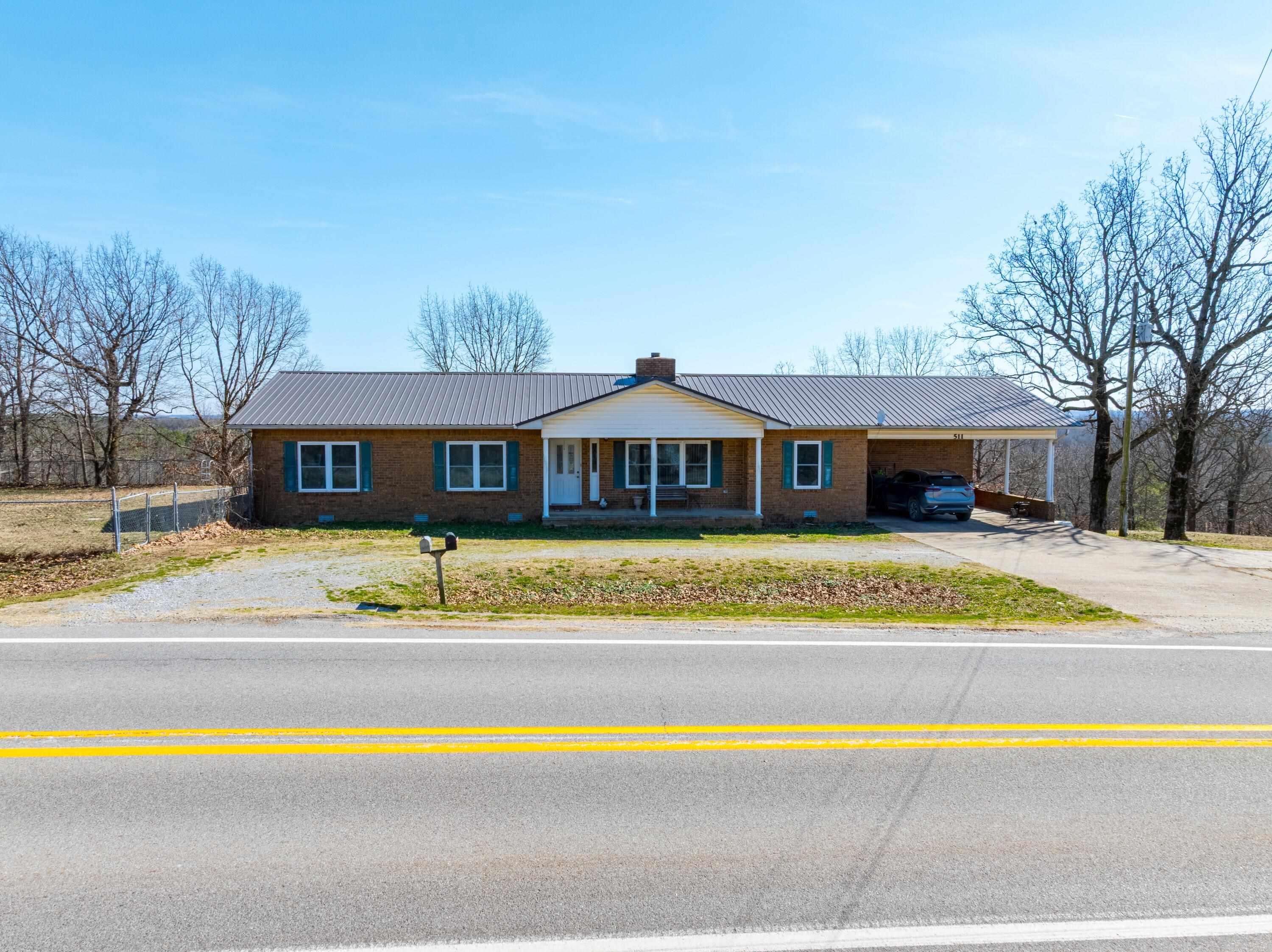 3 Bed 2 Bath Home with Shop on Acreage ā Perfect for Business & Country Living! If youāre looking for a home with extra space and a shop, this property offers the best of both worlds! With a well-built house featuring multiple living areas, a stunning brick fireplace, and plenty of natural light, this home is designed for both comfort and functionality. The spacious kitchen includes modern finishes, ample cabinetry, and a cozy breakfast area, while a large laundry room adds extra convenience. Step outside to enjoy the peaceful setting, complete with a deck perfect for relaxing or entertaining. The fenced-in yard provides a great space for pets, and the surrounding acreage offers privacy and potential for outdoor activities. The property also features a versatile shop, ideal for those needing workspace or storage. With frontage on a main road, itās a great opportunity for a home-based business or simply having easy access to town while enjoying a country setting. Water is Grange Calamine, Electric is North Arkansas Electric, Internet is NEXT (Fiber), and the Propane tank is rented.