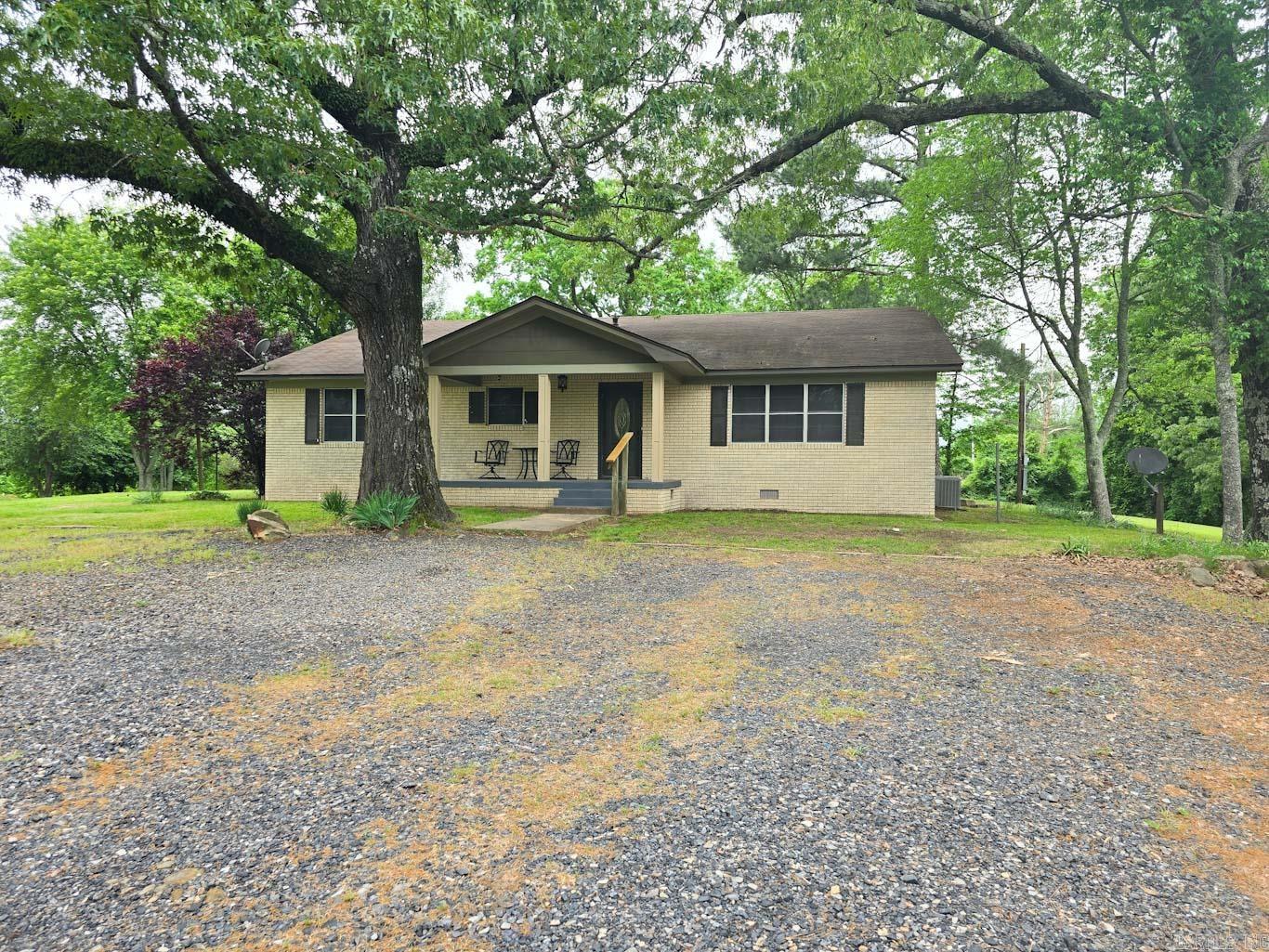 Nestled in the serene landscape of Rocky, Arkansas, this charming property offers a unique blend of comfortable living and versatile space. The main residence features 3 bedrooms & 2 bathrooms. Imagine cozy evenings around the working fireplace. For added flexibility, a studio apartment with its own kitchen & bathroom is situated above the enclosed garage. This separate living area presents excellent potential for guests, extended family, or even rental income. The enclosed garage itself provides abundant storage. The home rests on a 2.74-acre lot, offering plenty of room to roam & enjoy the natural beauty of the area. The front porch beckons you to relax & soak in the beautiful view of a sprawling pasture, a tranquil backdrop for your morning coffee or evening unwinding. Convenience meets country charm with this location. You'll find yourself approximately 13 minutes from the amenities of Mena & a mere 2.8 miles from the recreational opportunities of Wilhelmina Lake. The recently remodeled interior provides a fresh feel. Adding a touch of luxury & practicality are the cedar-lined closets in the main home, offering natural protection and a pleasant aroma for your belongings.