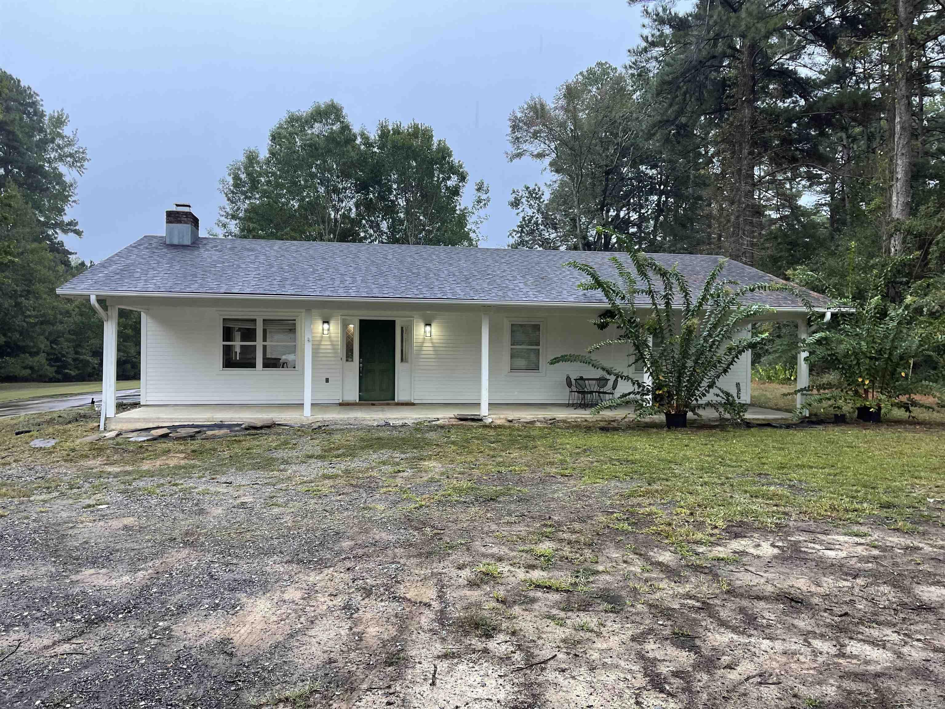 Wonderfully renovated home, conveniently located just south of I-530. 3.25 acres with a porch across the entire front of the house. Oversided carport with storage in the back. Both bathrooms were completely remodeled to include a walk-in shower in the Master and a new tub and shower in the hall bath. Both were custom built. Lots of privacy as the house sits approximately 300 feet off of the road. Please call for any additional information.