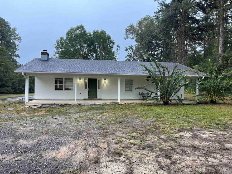 Wonderfully renovated home, conveniently located just south of I-530.  3.25 acres with a porch across the entire front of the house.  Oversided carport with storage in the back.  Both bathrooms were completely remodeled to include a walk-in shower in the Master and a new tub and shower in the hall bath.  Both were custom built.  Lots of privacy as the house sits approximately 300 feet off of the road.  Please call for any additional information.