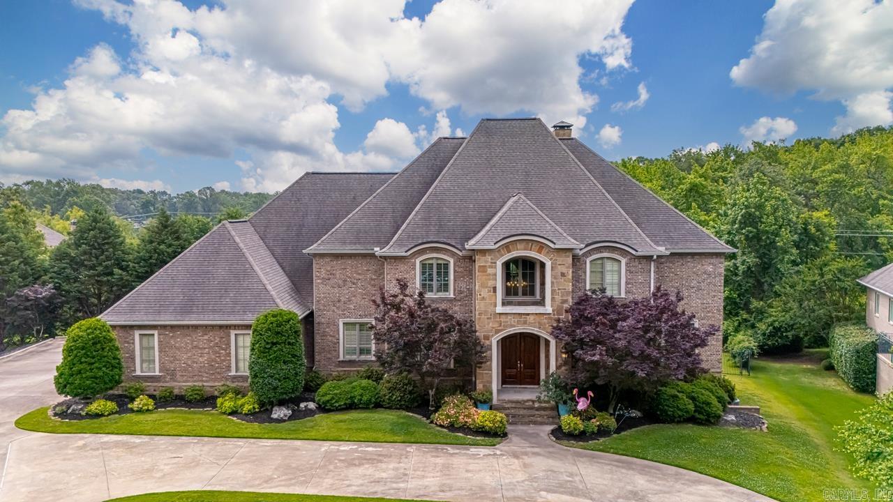 Impressive 3 level spacious home w designer touches on 1.5 acres in a desirable, gated NLR neighborhood. Convenient to shopping w easy access to interstate. Main level boasts the primary suite and guest suite, large kitchen with island- perfect for the chef in your family! A wet bar w icemaker and beverage fridge, breakfast bar and breakfast area, also a separate formal dining room. 20' ceiling entrance and living space flowing onto private covered patio overlooking pool. Stunning coffered ceiling office w built-ins. Upstairs offers 3 more BR (or 2 BR suites and a flex room), 2 baths and a theater room with new projector. Downstairs hosts another BR suite (perfect in-law or teen suite), 1//2 bath, living space and a flex room, leading out to another private covered patio flowing to the pool area. Huge storage area accessed from inside or outside the home with a double door entry from outside. More impressive storage under the home. New pool liner '18, added heater to pool in 2019, New pump Jan '25. Lighted sport court added in '12. 2 New HVACS in Nov '24. New hardwoods in primary and guest suite '19 and New LVP flooring down in '19. New SS fridge '23. A Must See!