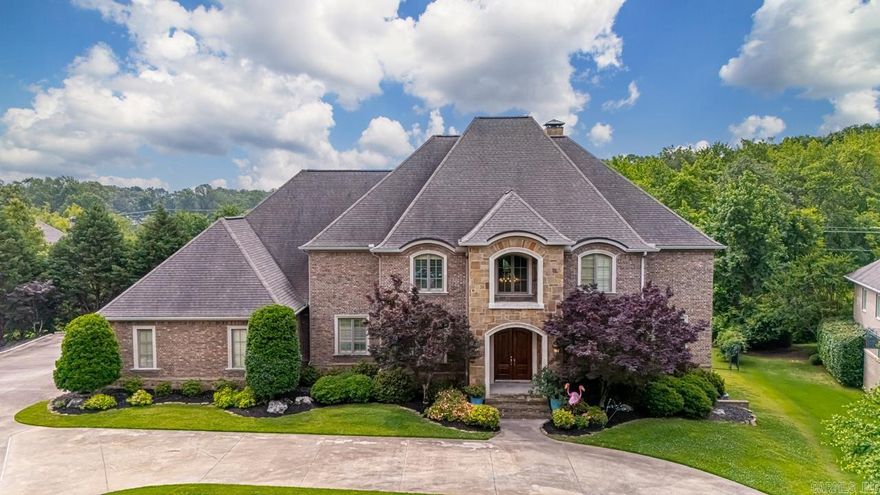 Impressive 3 level spacious home w designer touches on 1.5 acres in a desirable, gated NLR neighborhood.  Convenient to shopping w easy access to interstate.   Main level boasts the primary suite and guest suite, large kitchen with island- perfect for the chef in your family!  A wet bar w icemaker and beverage fridge, breakfast bar and breakfast area, also a separate formal dining room.  20' ceiling entrance and living space flowing onto private covered patio overlooking pool.  Stunning coffered ceiling office w built-ins.  Upstairs offers 3 more BR (or 2 BR suites and a flex room), 2 baths and a theater room with new projector.  Downstairs hosts another BR suite (perfect in-law or teen suite), 1//2 bath, living space and a flex room, leading out to another private covered patio flowing to the pool area. Huge storage area accessed from inside or outside the home with a double door entry from outside.  More impressive storage under the home. New pool liner '18, added heater to pool in 2019, New pump Jan '25.  Lighted sport court added in '12.  2 New HVACS in Nov '24.  New hardwoods in primary and guest suite '19 and New LVP flooring down in '19. New SS fridge '23. A Must See!