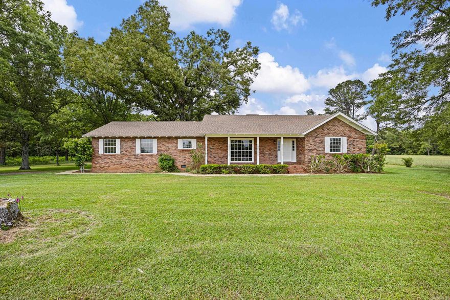 Situated on a perfect 13.02 acres of land, you will find this adorable well kept home ready to move in. This home was custom designed by Architect Charles Pearson and built by LC Hicks Construction. You will also love that its located only 8 - 10 minutes out from town, and in the Russellville school district. . This picturesque setting includes a pond, and one of the top 5 largest Willow Oak trees in the entire state, giving you a one of a kind view. There are 3 bedrooms, 2 full baths, and 1 half bath. Cook for the family in the large kitchen with tons of counter space, and enjoy the high ceilings in the living room. You will also find a large laundry room, connected to the half bath for convenience and guests. There are also 27.85 acres for sale next door to the property, if you are interested please don't hesitate to reach out. This won't last long, so make your appointment to see this home today!
