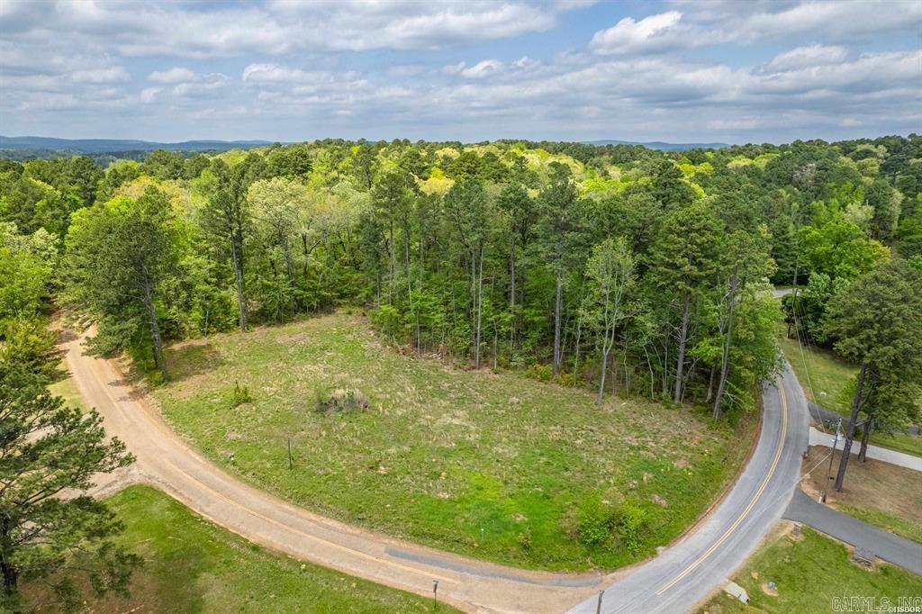 Beautiful level lot located across the street from the lake with view of Lake Hamilton. Perfect place to build your dream home. Lot has been cleared, surveyed and had a perk test performed. Utilities at the street. Bring your house plans and get started on building your dream home.