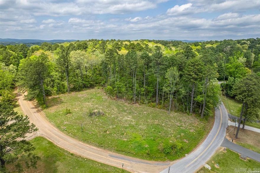 Beautiful level lot located across the street from the lake with view of Lake Hamilton. Perfect place to build your dream home.  Lot has been cleared, surveyed and had a perk test performed.  Utilities at the street.   Bring your house plans and get started on building your dream home.
