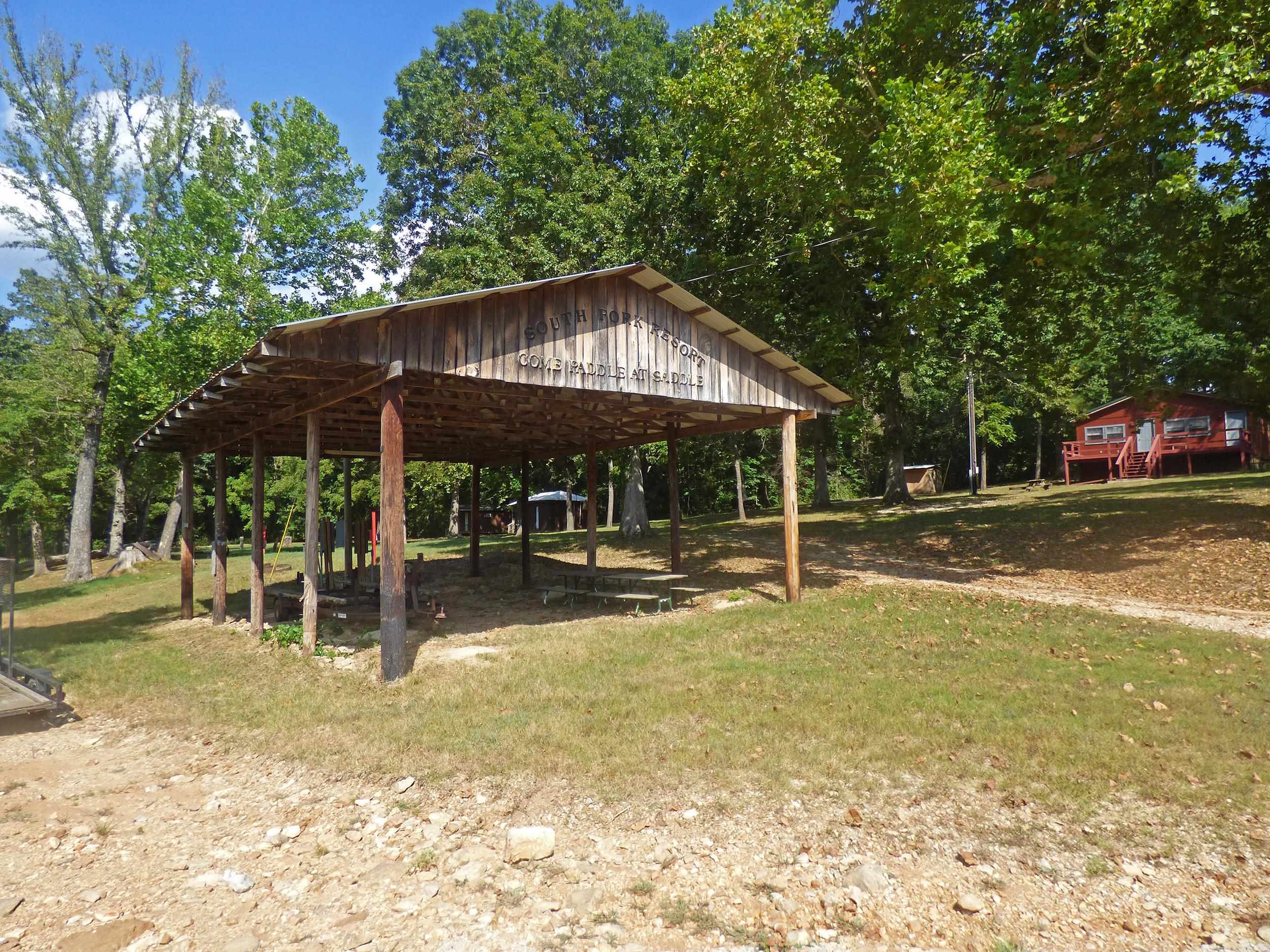 $125,000 Price Reduction!!! Live and Work on the Beautiful South Fork River - This property consists of 9.77 acres with gorgeous South Fork River frontage. Features an owner's home with 3 bedrooms, 2 baths, large living room, kitchen, fireplace, covered deck, log siding, and partially finished basement. The Resort has a 736 sq. ft. general store with retail space and storage area. General store inventory includes fishing poles & supplies. There are 7 cabins, 2 full RV hookup sites, 5 electrical only RV sites, 2 well houses (1 rebuilt in 2025). A large pavilion great for parties or events. Other inventory includes a school bus, 12 passenger van, 4 person rafts, canoes, kayaks, and life jackets.