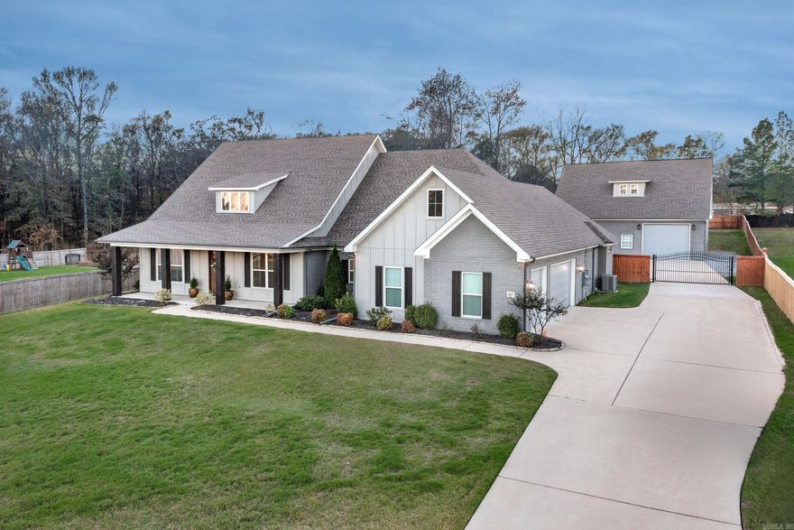 Buyer's Financing Fell Through!! Back on the Market!! An extraordinary 1 level home sitting on a 1 acre lot that is perfect for relaxing & quiet evenings by the pool or a fun & entertaining place for family and friends with the 40x40 building/workshop that is heated/cooled with a new epoxy floor and 1/2 bath. The exquisite main house is an open floor plan with high ceilings and custom touches throughout.  Office/living room off the entry.  3 bedrooms on a separate wing with a full hall bathroom and an en suite bathroom.  The living area and kitchen are open with a large island and an eat-in area. The kitchen is equipped with a butler's pantry, gas cook top, 2 ovens, microwave, quartz counter tops & an ice machine. Guest bath & an office area with cubbies is off the kitchen.  Private primary BR with a beautiful en suite bathroom with an ex-large shower, soak tub, 2 vanities and large walk in closet with access to laundry room. Beautiful covered patio with a FP. Saltwater inground pool. Fully fenced backyard. House generator. Tankless gas water heater. 3 car garage. So extra special!