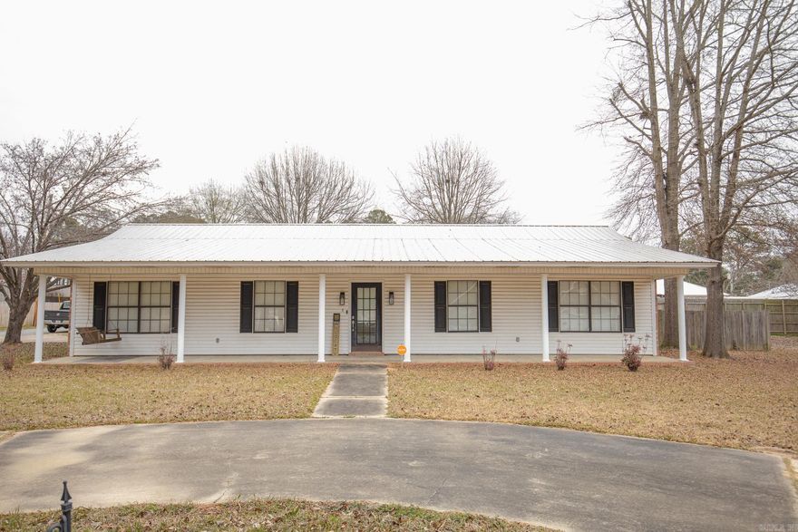 This 1,813 sq ft brick home offers 3 beds and 2 baths with modern updates throughout. The open floor plan creates a seamless flow for everyday living, dining, and entertaining. Updated bathrooms add a fresh, contemporary touch, while the slab foundation provides low-maintenance peace of mind. Enjoy outdoor living with a full-length front porch and a fenced backyard featuring a wood privacy fence and an above-ground pool -- perfect for relaxing or hosting friends and family. Additional features include a 2-car carport and a welcoming neighborhood known for amazing neighbors. Conveniently located within walking distance to the school, this home blends comfort, functionality, and a great community!