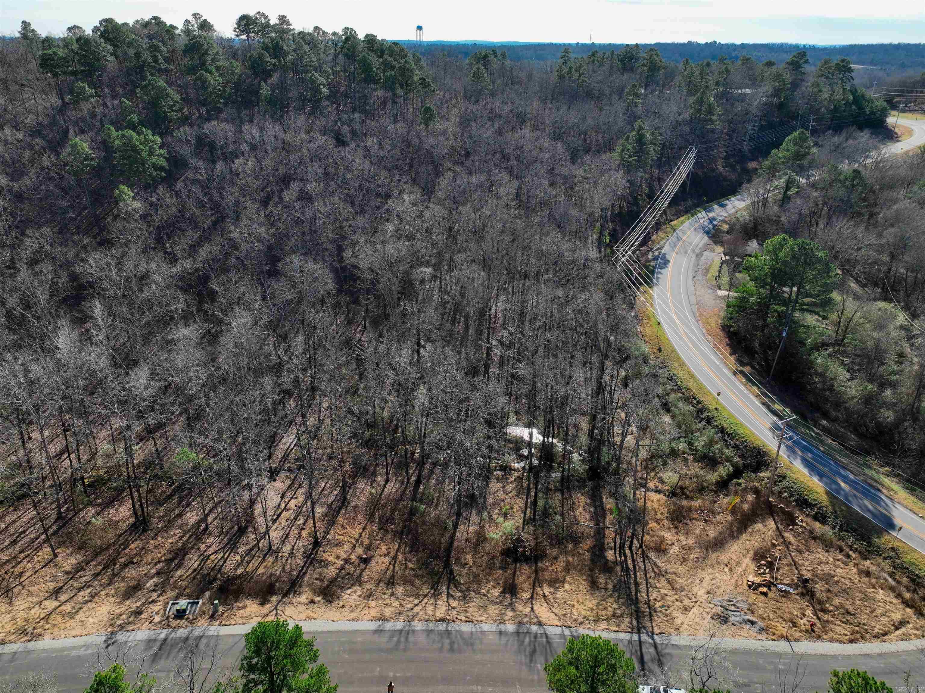 3.5 acre lot in Conway, Conway corp. utilities, Natural gas, Beaverfork water, Septic, Paved Road, use any builder, 2700 sq. ft. minimum Covenants and Restrictions.