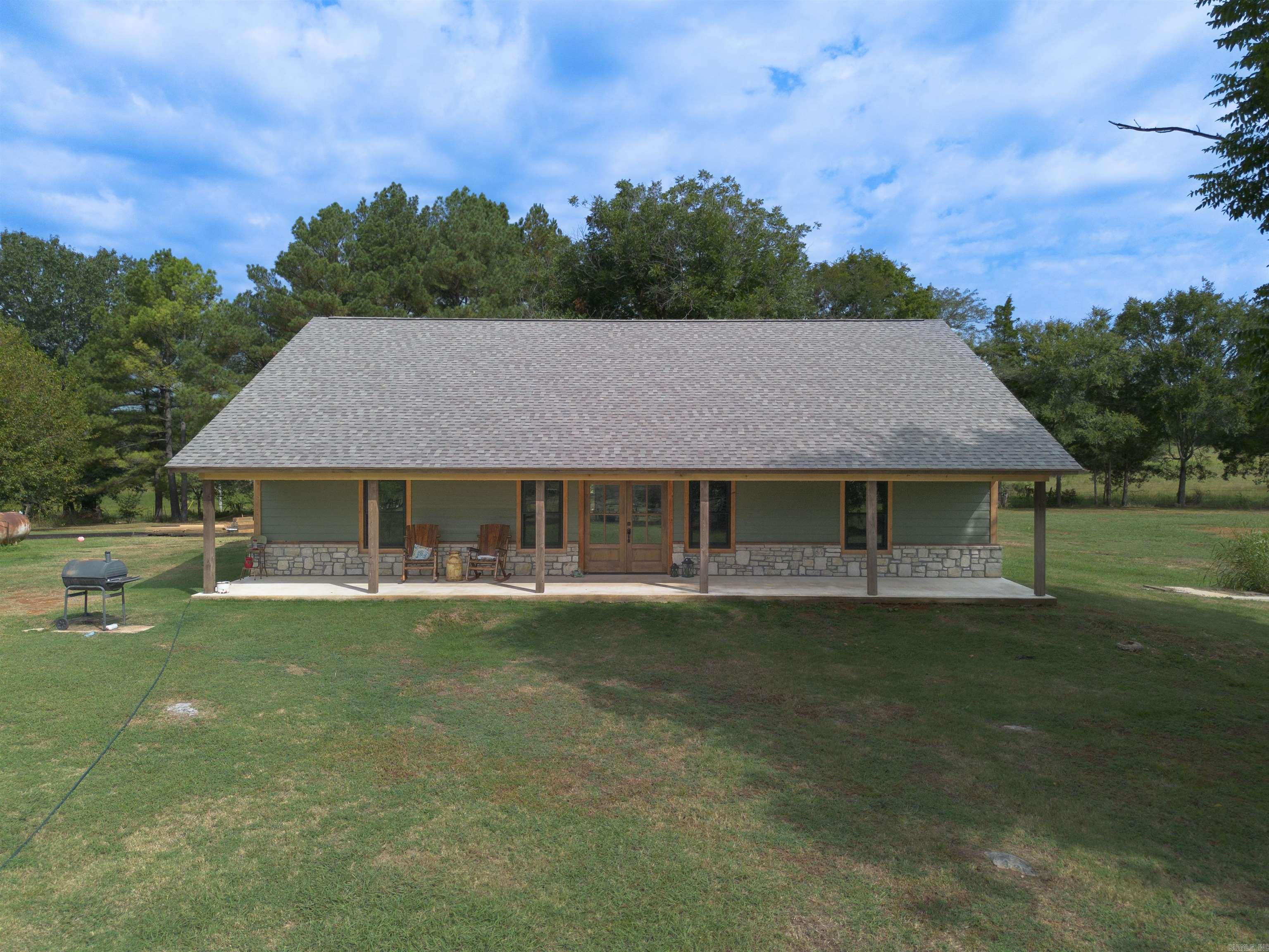 Tucked away in tall pines just off Blackland Road, your new home at Departee Creek Ranch overlooks the beautiful Departee Creek bottomland. Imagine settling into a rocking chair on the porch with a warm cup of coffee and enjoying the serene surroundings. This land offers endless potential for farming, ranching, recreation, or equestrian pursuits. The current landowners have spotted deer, turkey, and even mallard ducks. This is currently a mixed-use ranch, with owners historically running a cow-calf operation and reserving areas for hay production. They also enjoy evening horseback rides to check fences and count cattle. The 3-bedroom, 2-bath home is situated on the highest elevation of the property, safely out of the floodplain. Finished with a mix of cedar, pine, cypress, and sheetrock, it offers a rustic feel with all the modern amenities. The master suite features an ensuite with a walk-in shower, cedar closet, soaker tub, and direct access to the laundry room. The views are priceless, and the potential here is truly endless. If you are in the market for a one-of-a-kind property, please give me a call today!