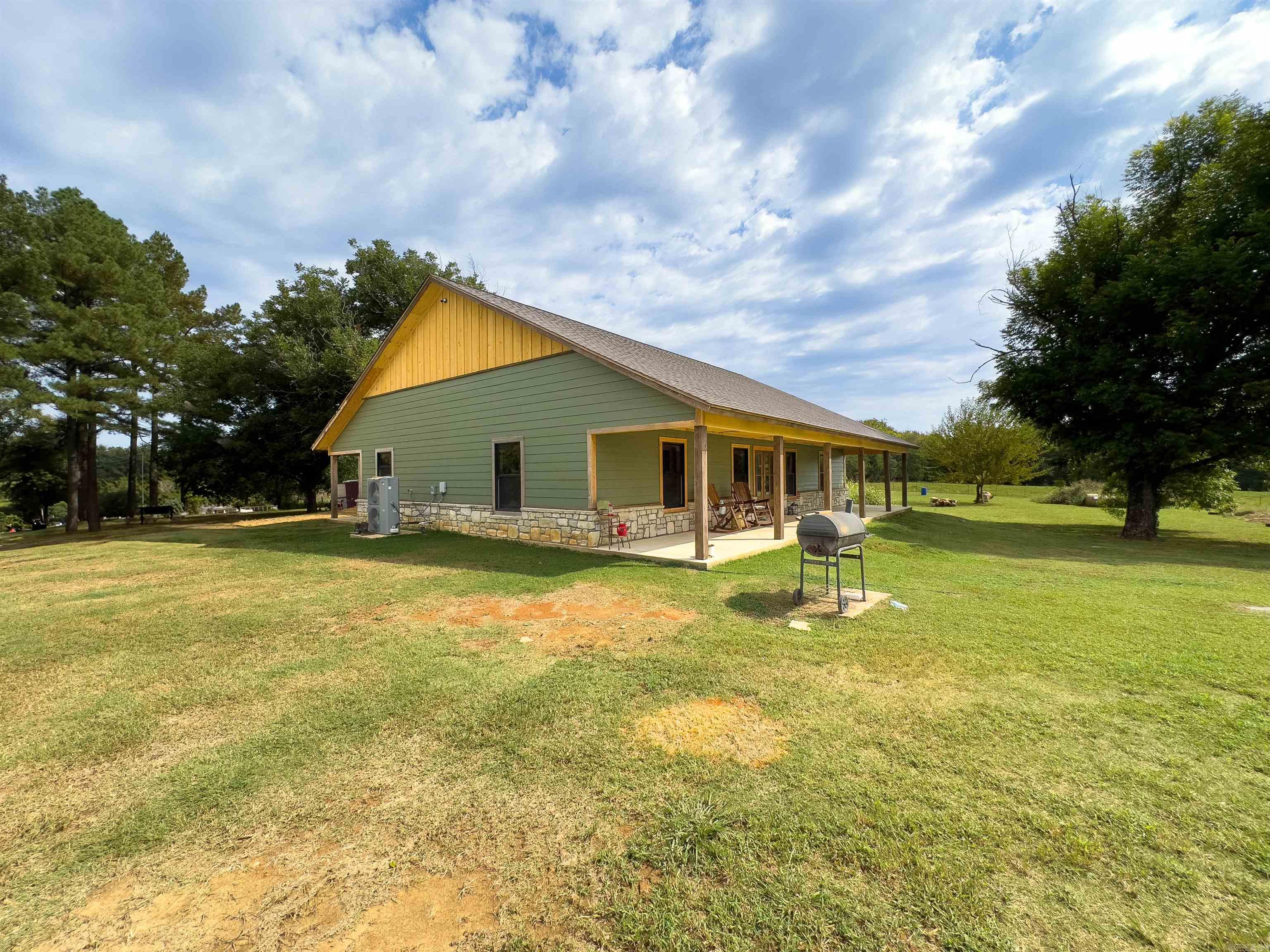 Tucked away in tall pines just off Blackland Road, your new home at Departee Creek Ranch overlooks the beautiful Departee Creek bottomland. Imagine settling into a rocking chair on the porch with a warm cup of coffee and enjoying the serene surroundings. This land offers endless potential for farming, ranching, recreation, or equestrian pursuits. The current landowners have spotted deer, turkey, and even mallard ducks. This is currently a mixed-use ranch, with owners historically running a cow-calf operation and reserving areas for hay production. They also enjoy evening horseback rides to check fences and count cattle. The 3-bedroom, 2-bath home is situated on the highest elevation of the property, safely out of the floodplain. Finished with a mix of cedar, pine, cypress, and sheetrock, it offers a rustic feel with all the modern amenities. The master suite features an ensuite with a walk-in shower, cedar closet, soaker tub, and direct access to the laundry room. The views are priceless, and the potential here is truly endless. If you are in the market for a one-of-a-kind property, please give me a call today!