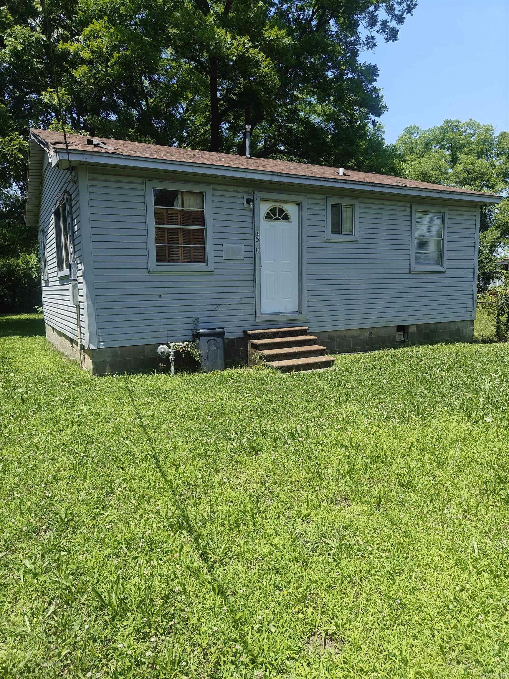 GREAT INVESTMENT property that will be a major fixer or can moved if you want to build. Stud walls are in place. Utilities are on the property, but not hooked up. House sells AS-IS. Nice back yard with 4'chain link fencing on 3 sides. A beautiful park just blocks away. Bring all offers!