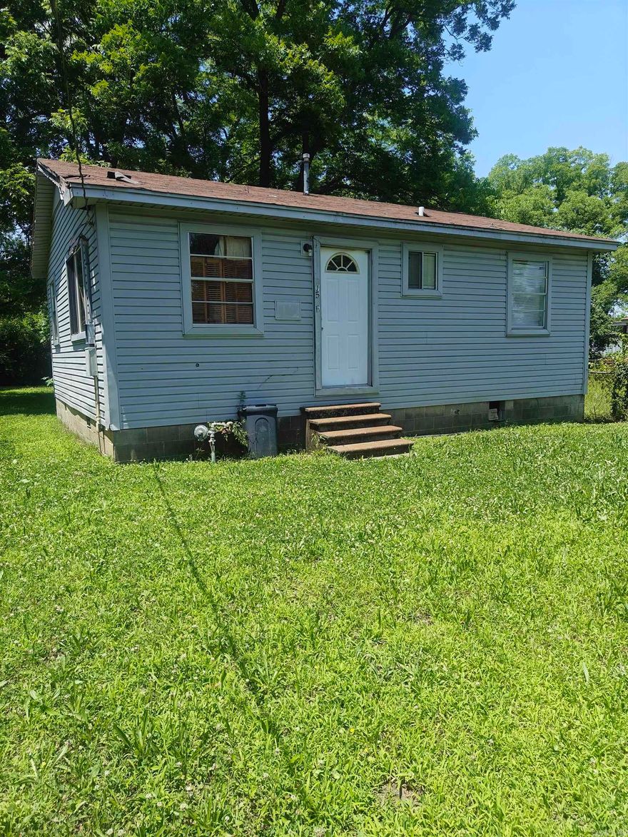 GREAT INVESTMENT property that will be a major fixer or can moved if you want to build. Stud walls are in place. Utilities are on the property, but not hooked up.  House sells AS-IS. Nice back yard with 4'chain link fencing on 3 sides. A beautiful park just blocks away. Bring all offers!