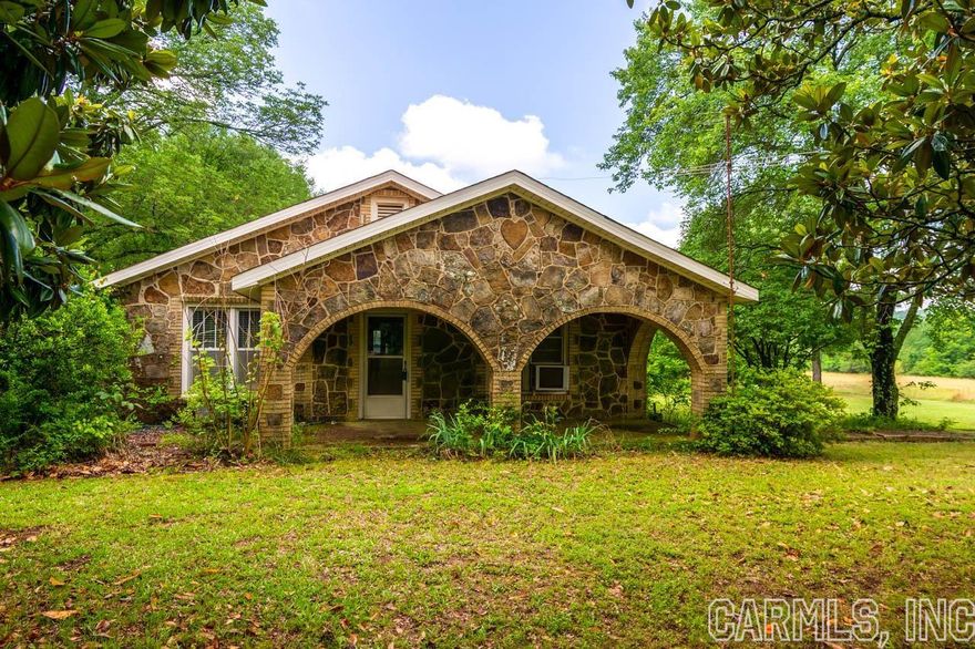 If you are looking for some beautiful land with a sweet little historic farm house to make your own you need to see this property! The land is inviting and very usable as it is flat and has two ponds as well. The property is on both sides of El Paso Road, and has an adorable farm house that was hand built with love. All the rock came from the land there itself and the craftsmanship in this home is something to see.  So much charm and history, it takes you back in time but yet it is so close to Beebe, Cabot, Vilonia and modern conveniences.  Property is sold as is , no mineral rights convey.