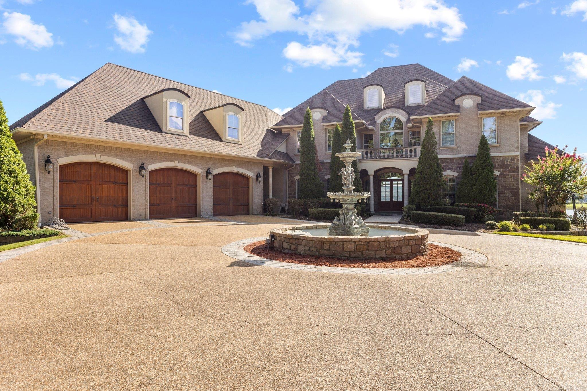 Discover lakeside luxury at Hurricane Lake Estates! This 5-bed, 4.5-bath Tuscany-French-inspired home offers panoramic lake views from every room. Step inside and be welcomed by the high ceilings, oversized chandeliers, elegant trim work, intricate tray ceiling details, and large windows. The main floor hosts the primary suite with a spa-like en-suite. The gourmet kitchen seamlessly connects to the living area. Four additional bedrooms grace the upper level, each capturing unique lake perspectives. The oversized laundry room adds practicality with built-in cabinets. Step outside to a veranda overlooking the inground pool and lake. The large back yard offers an ideal space to relax and entertain. A private boat dock completes the lakeside experience, allowing easy access to water activities. This residence harmoniously blends indoor and outdoor living, providing a serene retreat. Make this lakeside haven in Hurricane Lake Estates your home and embrace the luxury of waterfront living.