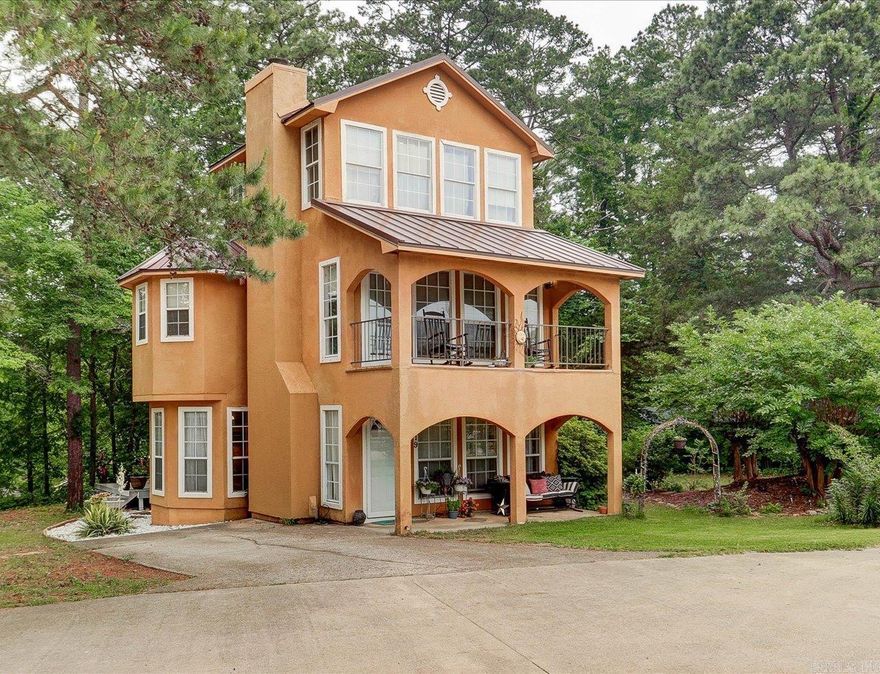 BEAUTIFUL 3-STORY HOME OFFERING BREATHTAKING VIEWS OF LAKE HAMILTON. In the sought-after Lake Hamilton School District and just outside city limits, this home offers an ideal setting for a family home or a vacation retreat.   The property comes with three additional lots, providing possibilities for expansion or even building a guest home. Whether you're looking to create your dream space or invest in a rental property, this is a great opportunity.  With three spacious bedrooms and two full baths, there's plenty of room for everyone to relax and unwind. Enjoy the stunning lake views from your private balcony, the perfect spot to savor your morning coffee or watch the sunset.   Additional Features Include:  - Electric fireplace  - Soaking tub with beautiful views  - Dog run  - Firepit - Covered Patio - Covered Balcony - Floor to ceiling windows  - And more!   The location is unbeatable, less than 15 minutes to Downtown Hot Springs, with easy access to all the amenities you need while enjoying the peaceful surroundings. Short-term rentals are allowed, making this an excellent investment opportunity. COME AND SEE!   Agents - please schedule all showings with Showing Service.