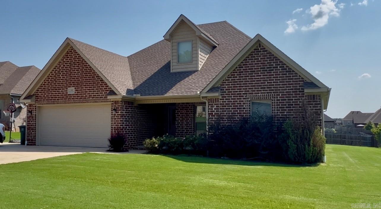 Brookland School District. This all brick 4 bedroom, 2 bathroom home has 2,077 SqFt and sits on 0.29 +/- of an acre inside the Whispering Hills Subdivision. Having a split floor plan, enjoy the best of both worlds, a spacious layout and privacy with the primary suite. Featuring a tray ceiling, dual walk-in closets, dual vanity with granite countertops, a soaker tub, and a custom tile shower. Large living room area with tall ceilings, huge windows creating plenty of natural light, and a gas log fireplace. The kitchen features granite countertops, stainless steel appliances, and a breakfast bar with dining area. Additional features include a front porch, large backyard, a covered deck/patio, storm shelter in the garage and a large driveway with extra parking pad. Call to set a showing today! Appointment needed for showings.