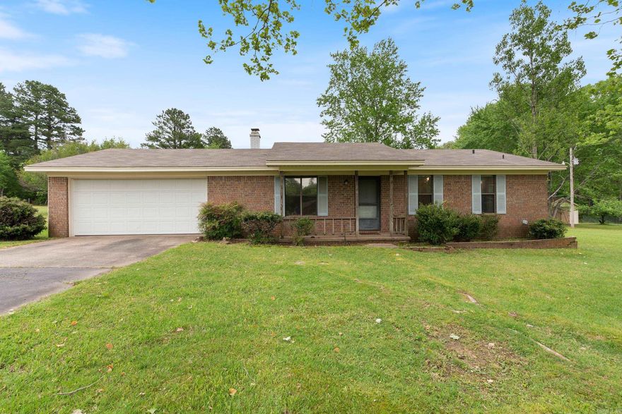 This home features 3 beds and 2 baths with an extra spacious den in addition to the living room and a wonderful covered back porch for relaxing! Have you been looking for a home with a nice large yard? This is it! In the backyard you will find two large outbuildings for your storage and workshop needs! It also has a long paved driveway and an additional parking pad, mature trees and a new roof installed in 2023. You are winning with this home and peaceful location! AGENTS SEE REMARKS!