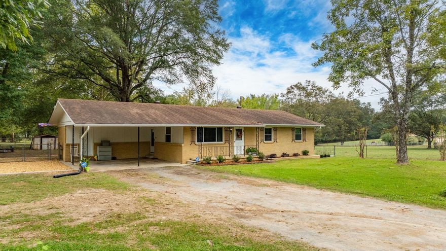 Enjoy peaceful country living with longhorn cattle as your next-door neighbors—all just minutes from Little Rock grocery stores, restaurants, and shopping! This charming 3-bedroom, 2-bath home sits on 2 beautiful acres and is the perfect combination of old and new. You'll love the original hardwood floors, cozy wood burning stove, mature shade trees, and the beautifully updated kitchen with custom-built solid maple cabinets. Other recent updates include fresh interior paint, new landscaping with a pea gravel patio area, encapsulated crawl space, updated plumbing, new hot water heater, new microwave, freshly cleaned ductwork, and an energy assessment. The home was also recently power washed and the septic tank serviced - it is move in ready! With its quiet country setting, modern touches, and wide-open space, this home offers the perfect blend of comfort, character, and convenience. Agents see remarks. Photos show virtual staging.