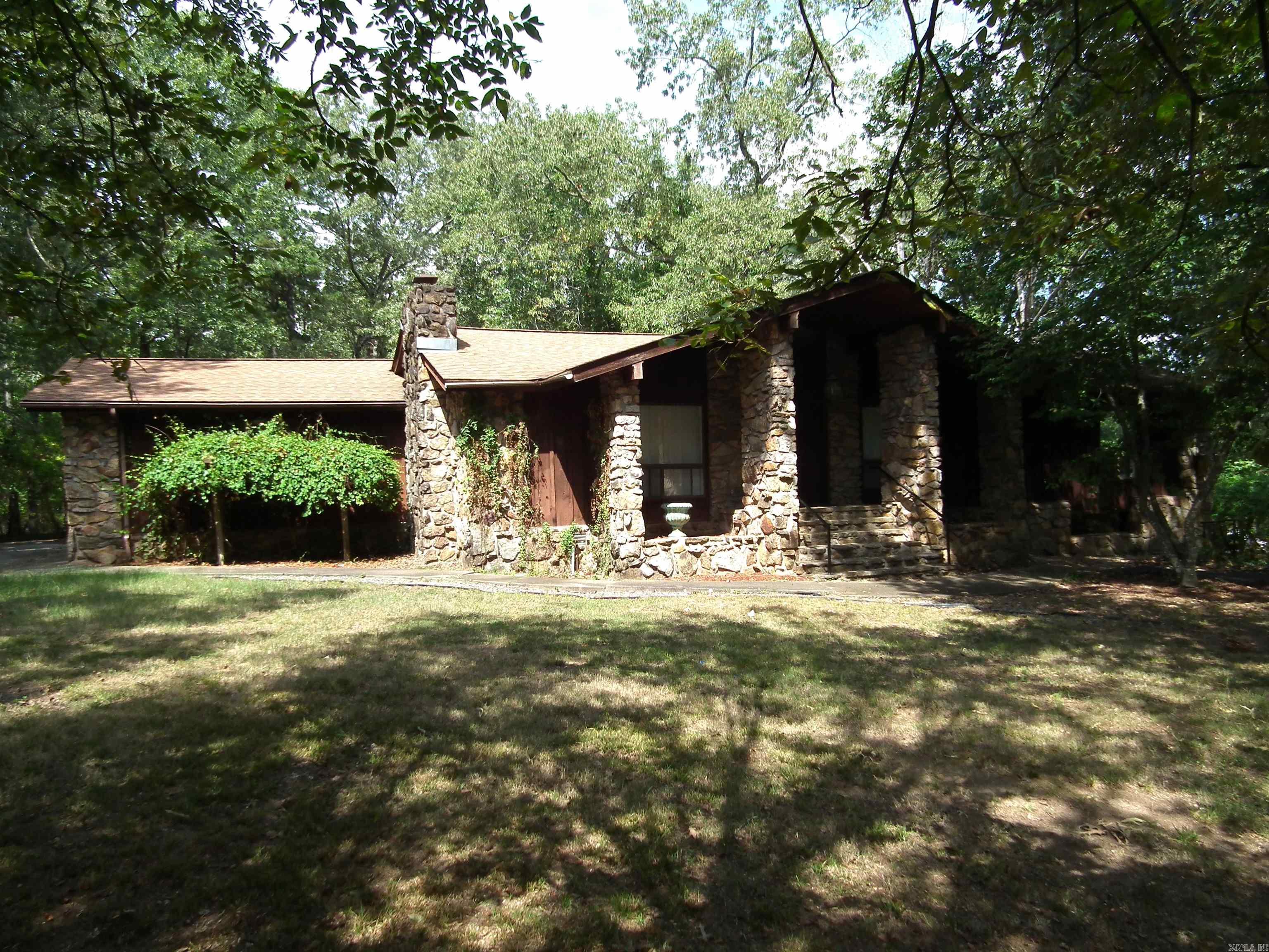 So very much to offer. Beautiful home located on just over an acre. Impressive stone entrance. Vaulted ceiling, hardwood floors. Fireplace. Logan cabinets in updated kitchen. Huge walk-in pantry. Primary with gorgeous bath & 2 walk-in closets. Extras:384 square foot basement level bonus room, "man cave" workshop & 9x42 enclosed porch overlooking the back yard. Lots of storage space. This is a gem.