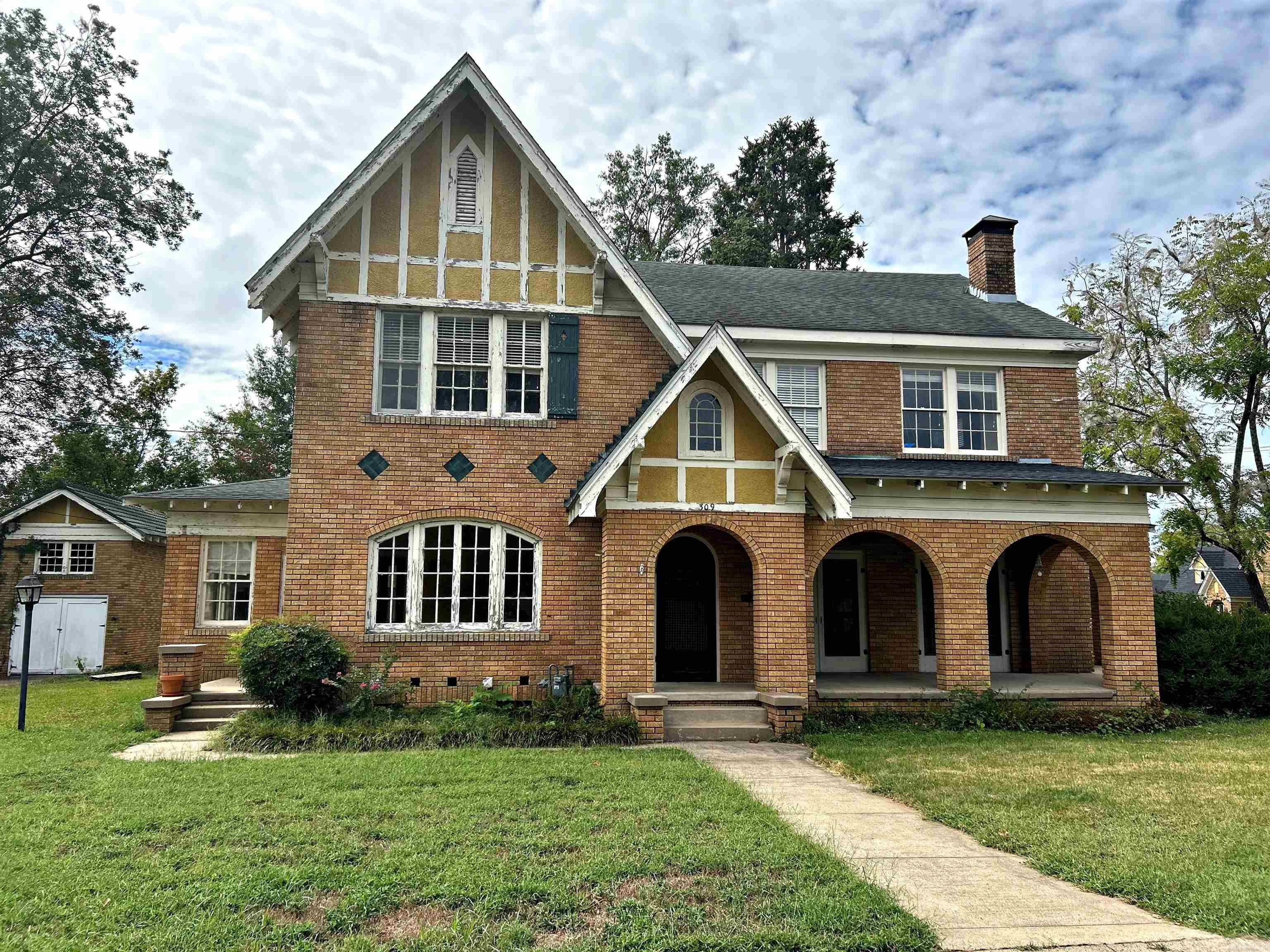 This is a must-see historical home in the heart of Arkadelphia sitting only a couple of blocks from OBU and the Ouachita River. Built in the 1920's, this charming house has 6 bedrooms with 2 additional spaces for bedrooms, library or offices. There is a formal dining room, sunroom, a cedar lined closet and lots of storage spaces. The living room is spectacular with a stunning gas log fireplace. Nice, well-kept hardwood floors run throughout the house. The 2 bathrooms have been partially updated with the beautiful historic tile floor remaining in place. The shop out back is two-story with additional storage attached to the back of it. While some TLC is needed inside and out, the possibilities are endless with this beautiful property. Call and make an appointment to see it today! (See showing remarks.)