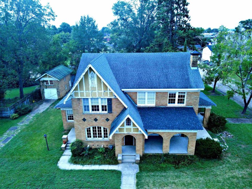This is a must-see historical home in the heart of Arkadelphia sitting only a couple of blocks from OBU and the Ouachita River.  Built in the 1920's, this charming house has 6 bedrooms with 2 additional spaces for bedrooms, library or offices. There is a formal dining room, sunroom, a cedar lined closet and lots of storage spaces. The living room is spectacular with a stunning gas log fireplace.  Nice, well-kept hardwood floors run throughout the house.  The 2 bathrooms have been partially updated with the beautiful historic tile floor remaining in place. The shop out back is two-story with additional storage attached to the back of it. While some TLC is needed inside and out, the possibilities are endless with this beautiful property. Call and make an appointment to see it today!  (See showing remarks.)
