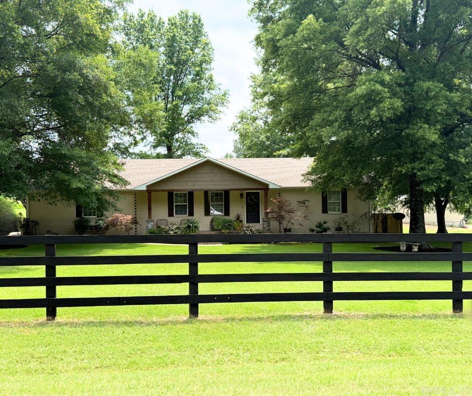 Located at 641 Greene 729 Rd in Paragould, this beautifully maintained home offers the perfect combination of country living and modern convenience. Situated on approximately 2 acres with paved road access, the property features stunning landscaping, mature trees, and is located in the desirable Greene County Tech School District on the south side of town. Inside, you'll find a spacious layout with 3 bedrooms and 2.5 bathrooms, plus an oversized bonus room with a half bath that can serve as a 4th bedroom, game room, or additional living area. The home boasts a custom kitchen and laundry room, hardwood and travertine flooring, and a primary suite complete with two walk-in closets. Outside, enjoy summer days by the in-ground pool and take advantage of the 30x50 shop with 14' walls—perfect for RV parking, a workshop, or storage for all your toys. Recent updates include a new roof and water heater within the last 3 years. This is a rare opportunity to own a move-in-ready home with space, style, and functionality in a highly sought-after location. Agents- please see remarks.