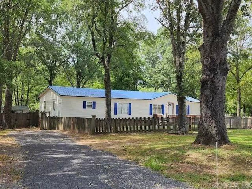 Introducing the charming home at 54 Summerwood Drive in Cabot, Arkansas! This new listing is perfectly positioned on a peaceful, picturesque street and is fully updated from top to bottom. The home offers a generous lot size providing ample outdoor space for relaxation and activities with a fully fenced front & backyard. As well as, a 12’ x 20’ shed, front deck & screened in porch. Boasting three well-appointed bedrooms and a versatile extra living area that can be easily converted into a fourth bedroom, this residence is ideal for both growing families and those in need of ample room.This recently updated home features a new metal roof, all new paint, trim, flooring throughout, hardware, light switches & outlets