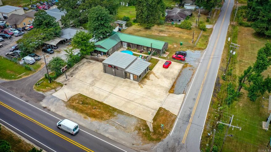 Excellent income producing property. 100% occupied with quality rental history.  Front Garage unit has a 3 year lease, and the residential units have long time occupancy. Tenant and two residential units. Call listing agent for appointment only 501-960-8501