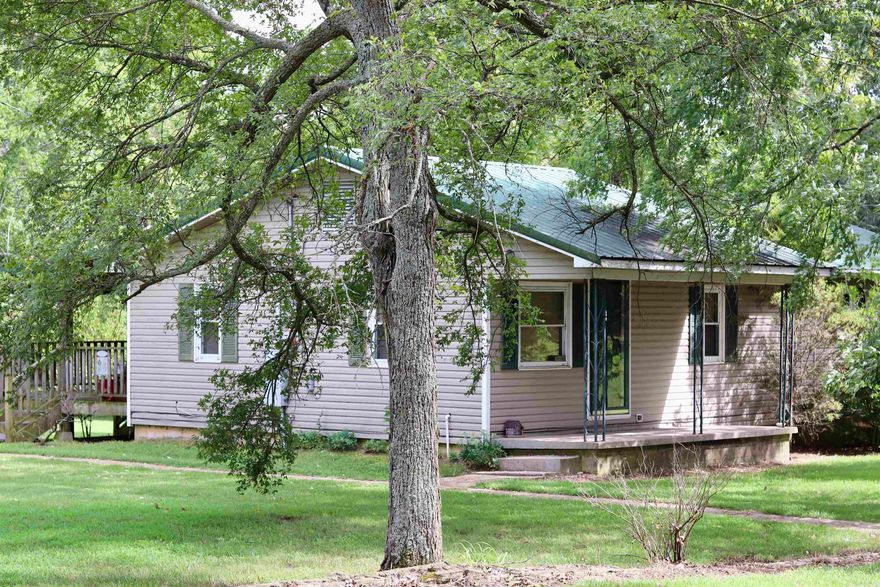 Hello country living - with the convenience of town!! 350 Jerusalem Road in Strawberry is it's own piece of country life but still sits in city limits, meaning city utilities, close proximity to local businesses, and a paved road! This home comes with 9 acres of beauty, a large pond, gorgeous Weeping Willows, and lots of large hardwoods. With 5 acres of pasture and 4 acres of timber, this property would make a great hobby farm or even an awesome place to look off the large back deck and just relax. House is 960 square feet of charm with 3 bedrooms, 1 bath, and a walk-out basement! Property also includes a barn, small chicken house, another outbuilding for animals/storage/work, detached one-car garage, and a 25x35 insulated shop building with electricity ran to it. The shop building also has a 12x12 overhead door and an RV hookup under the attached 25x35 overhang on the back of the shop, lights and ceiling fans already installed, and a great spot for a wood stove! Call today before it's gone, let's take a look at this great property!!