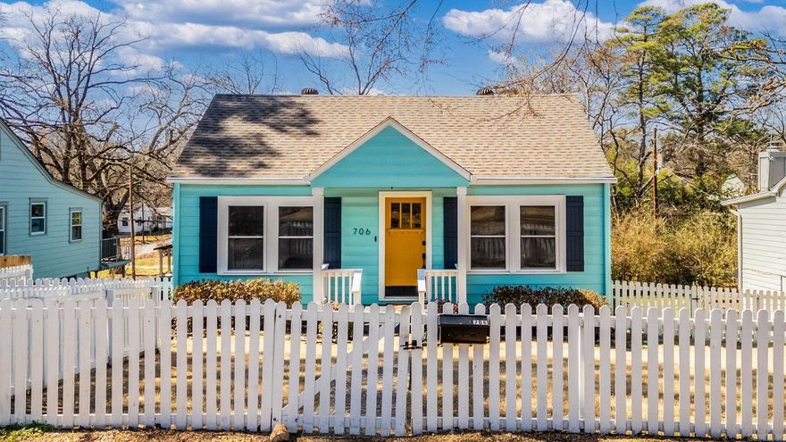 Welcome home to this storybook 1952 bungalow in the heart of Hillcrest -where timeless charm meets modern comfort. From the moment you see the white picket fence & blooming multi-colored hydrangeas, you’ll feel the warmth and character that make this home so special. Inside, 1,597 square feet lives large with a flowing floor plan. Craftsman-style built-in shelving frames the cozy gas fireplace -the perfect setting for quiet evenings. The kitchen is updated with granite countertops, stainless appliances, & a spacious pantry. Offering flexibility to fit your lifestyle, the home features 4 BR & 2 BA- or 3 BR w a dedicated office for working from home. Downstairs, you’ll find a private living space/bedroom ideal for guests, or a creative retreat, + a workout room & laundry. Step outside & relax in the hot tub under the covered porch. With alley-access garage parking plus off-street parking in front. The roof was replaced in Sept 2020, & modern touches like Nest HVAC controls & a doorbell cam add peace of mind. This home will surprise you. It feels bigger than you expect, warmer than you imagine, & more charming than words can describe. Come experience this Hillcrest gem today!