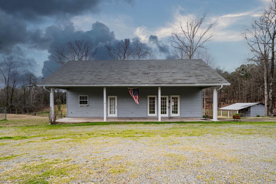 Great country home with fenced pastures, horse farm, electric Corning Ware range, granite countertops in kitchen & baths, freshly painted, security gate, storage building, barns, etc.