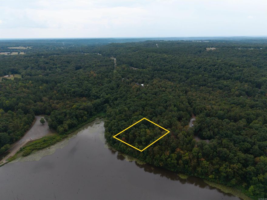 Dreaming of owning water front property on Lake Barnett!? This is your chance. Over 3 quarters of an acre ready to be developed with your personal touch. Come build your dream lake house or fisherman's getaway. Mobile homes allowed. Recent Survey on file. Utilities at the road. Don't miss this opportunity. Needing more land? I've also listed 1.15 acres adjacent to this lot. See separate listing MLS#25036741. Call now!