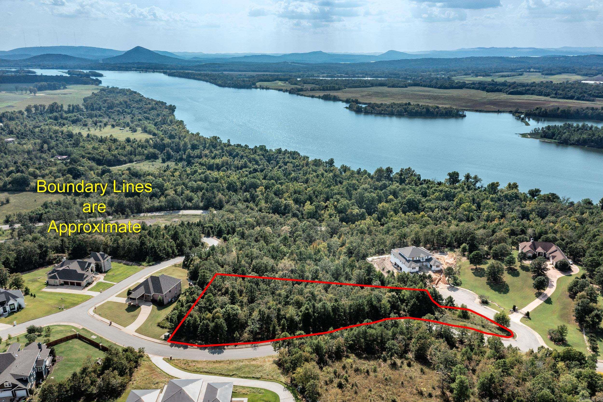 Wow! The views from this lot are spectacular. Once a home is built on this lot you may have a view of the Ar. River from every room. View of Pinnacle Mt. Incredible Sunsets when the river turns a red glow as the sunset reflects on the river. This is one of the largest lots available. Don't miss this opportunity. An artist paints from this lot. Once you see the view you will know why. Under ground utilities water, electric, gas, sewer and att high speed internet. 2500 Minimum Sq. Ft to build. Gated but open Sat & Sun 1-4