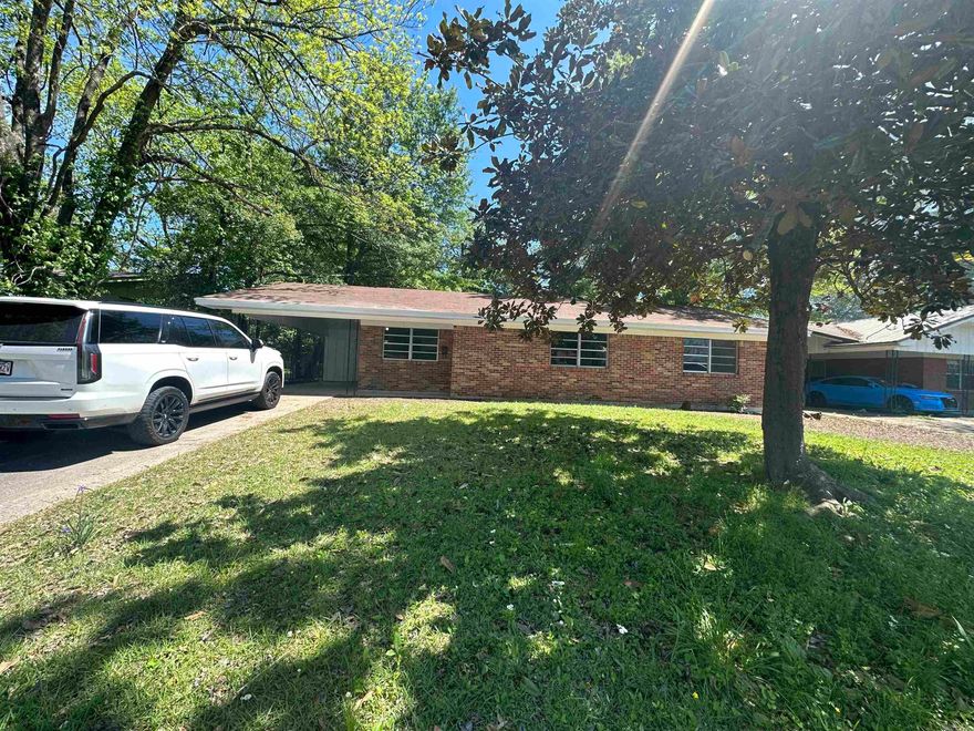 Welcome to this charming 3 bedroom home. Newly remodeled, Perfect for a first time buyer or family! This cozy home offers a comfortable living space with an open kitchen/dining and living area. An oversized island captivates the room with lots of counter top space and storage, and is perfect for fixing meals and eating on while watching tv in the living area that has a beautiful brick accent wall and wooden ceiling!!There is 1 full bath as well as a half bath for guest.  Large back yard for entertaining and children playing! Call for your tour today!!