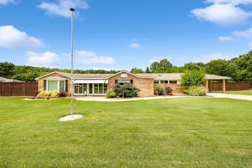 With over 3,000 sq ft, this spacious home offers endless versatility to fit any lifestyle. Inside, you'll find 3 bedrooms, 2 bathrooms, two living areas, a formal dining room, and a flex space or craft room perfect for hobbies or a home office. The layout is ideal for both everyday living and entertaining, and the screened-in back porch provides a peaceful retreat year-round. Outside, the property continues to impress with a storage building with electricity, a separate workshop, and a professional-grade putting green for golf enthusiasts. Enjoy evenings under the gazebo with multiple gas fire pits, all surrounded by beautifully maintained landscaping. Whether you're upsizing, downsizing, or just ready for something new, this home is full of charm, function, and and endless possibility! See agent remarks.