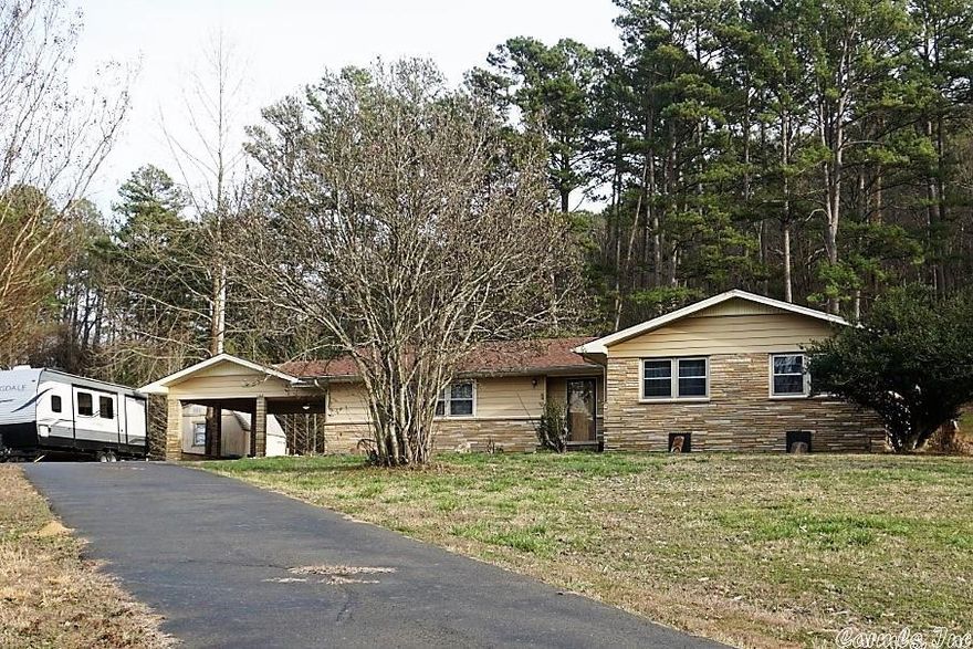 Move in ready! 3 bedroom, 2 bath home, 10 to 15 minutes from lake access and just over a mile from town. Beautiful hardwood floors and new tile. Bonus room with storage and pantry (deep freeze included!) Located on a very nice 2.68 acre lot. New roof, hot water heater and AC in end of 2020/early 2021. Refrigerator/Washer & Dryer also convey.