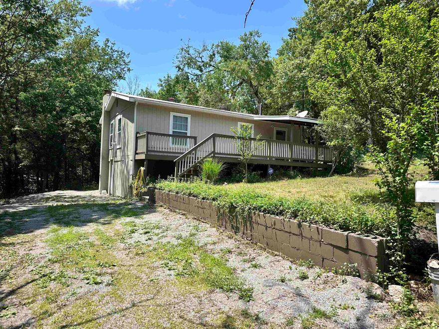 Charming Fully Remodeled Lake Area Home on 3 Lots! This adorable all-electric (w/200-amp svc) home offers comfort, privacy, and a seasonal view of Lake Sequoyah — all within walking distance to Gitche Gumme Beach and the dog park! This property combines a peaceful rural feel with convenient access to nearby amenities, incl swimming, fishing, golf, boating etc. Extensive updates throughout: • New 2-ton HVAC system with heat pump, new ductwork and thermostat for efficient year-round comfort. • New windows • New insulation and drywall • New joists • All new wiring and PEX plumbing • New laminate flooring • New interior doors and trim • Recessed lighting with night light option • New smoke detectors • New water heater • New oak kitchen cabinets with butcher block countertops • New tile, vanity, and sink in bathroom • New exterior paint • Motion sensor lighting • New back deck perfect for relaxing outdoors. • Front deck is partially covered. • All appliances all stay, along with the stackable washer and dryer. Take in the peaceful surroundings around the fire pit. MOVE-IN READY! (Furniture negotiable!) Perfect for starter or weekender home in this famous fisherman's paradise!