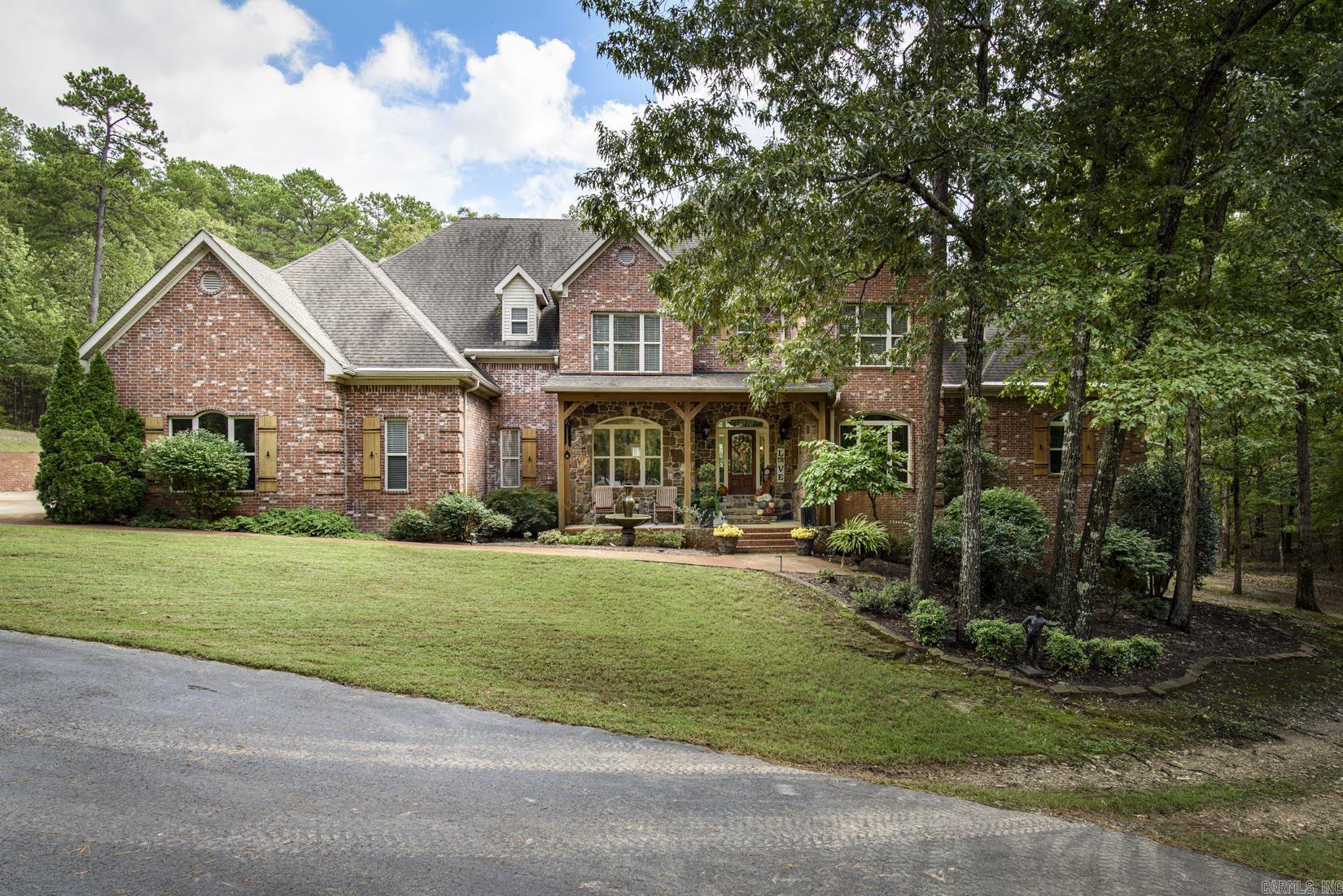 Peaceful retreat offering privacy, space & abundant tranquil entertaining areas outdoors, as well as inside. A gated, graceful drive leads to this well-maintained home w/ inviting front porch. Step inside to find soaring ceilings, beautiful moldings and pretty hardwood floors. To the right of the foyer is a bar area with ice machine & beverage drawers, to the left of the foyer is a spacious Formal Dining area that opens to the 2 story greatroom overlooking deck and swimming pool. The chef's kitchen was remodeled in 2018 w/ all new appliances including, a 6 burner gas stove w/ griddle & pot filler, built-in fridge, microwave, warming drawer, 2 dishwashers, Sonic ice machine, hot water dispenser & new cabinetry. Conveniently located nearby is the breakfast area & hearth room. Travertine floors & lots of light make for a great entertaining area. The primary bedroom suite has a FP, large walk-in closet, and office/nursery nearby. Upstairs are 3 bedrooms & 2 baths plus large game room. The home has a 3 car garage & additional detached 3 car garage w/ upstairs room currently used as an exercise room. The saltwater gunnite pool and gazebo all make for a private backyard oasis. See remarks