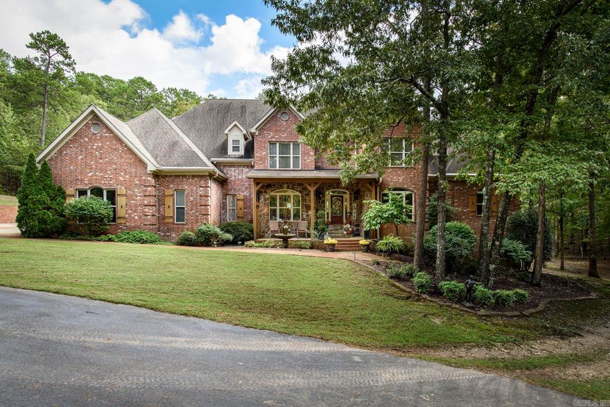 Peaceful retreat offering privacy, space & abundant tranquil entertaining areas outdoors, as well as inside. A gated, graceful drive leads to this well-maintained home w/ inviting front porch. Step inside to find soaring ceilings, beautiful moldings and pretty hardwood floors. To the right of the foyer is a bar area with ice machine & beverage drawers, to the left of the foyer is a spacious Formal Dining area that opens to the 2 story greatroom overlooking deck and swimming pool. The chef's kitchen was remodeled in 2018 w/ all new appliances including, a 6 burner gas stove w/ griddle & pot filler, built-in fridge, microwave, warming drawer, 2 dishwashers, Sonic ice machine, hot water dispenser & new cabinetry. Conveniently located nearby is the breakfast area & hearth room. Travertine floors & lots of light make for a great entertaining area. The primary bedroom suite has a FP, large walk-in closet, and office/nursery nearby. Upstairs are 3 bedrooms & 2 baths plus large game room. The home has a 3 car garage & additional detached 3 car garage w/ upstairs room currently used as an exercise room. The saltwater gunnite pool and gazebo all make for a private backyard oasis. See remarks