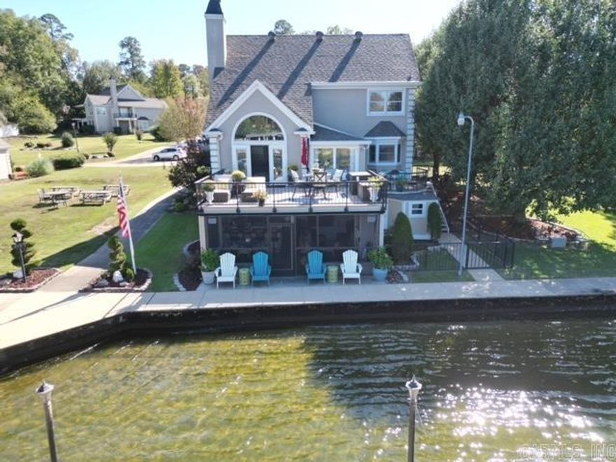 THIS IS IT!  Fabulous Quality Updated home on Lake Hamilton with Sunrise Views and Sunset Views! Incredible! Just off Central Ave. Close to everything! Boat Slip Included! Quiet Gated Neighborhood has 7 homes. 3 Bedrooms - 3 Baths and 2 half baths! Primary is on main level with knockout bathroom! 2 other BR's up with 2 baths up. Also, Half bath down and half bath off garage for mud room! Sq Ft does not include the Wonderful Entertaining room/screened in porch with fireplace and sink and TV and more! (Approx. 450 sq ft) Great Man Cave with Great Lake Views! Dream Kitchen has huge quartz island/bar with separate veggie sink. Open Concept and awesome floor plan! Brand New 30 yr Roof! Also, optional adjoining lot #8 - closest half of Lot 8 is negotiable. Neighbor owns the other half) Lots of extras everywhere! This is really one of a kind property and one of the best locations on the lake!  SEE AGENT REMARKS!