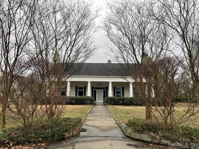 Motivated seller. Being sold as is. The home has suffered some water damage. This spacious and classically designed home contains all the charm you would want with the perfect appeal of an "ah Ha" house. You drive up in front in a circle drive that welcomes you. The entrance hall has high ceiling, looking right into the formal living room/parlor and formal dining across the hall. A bedroom wing holds 4 bedrooms with a bathroom for each.An atrium with open sky and back yard has perfect views.
