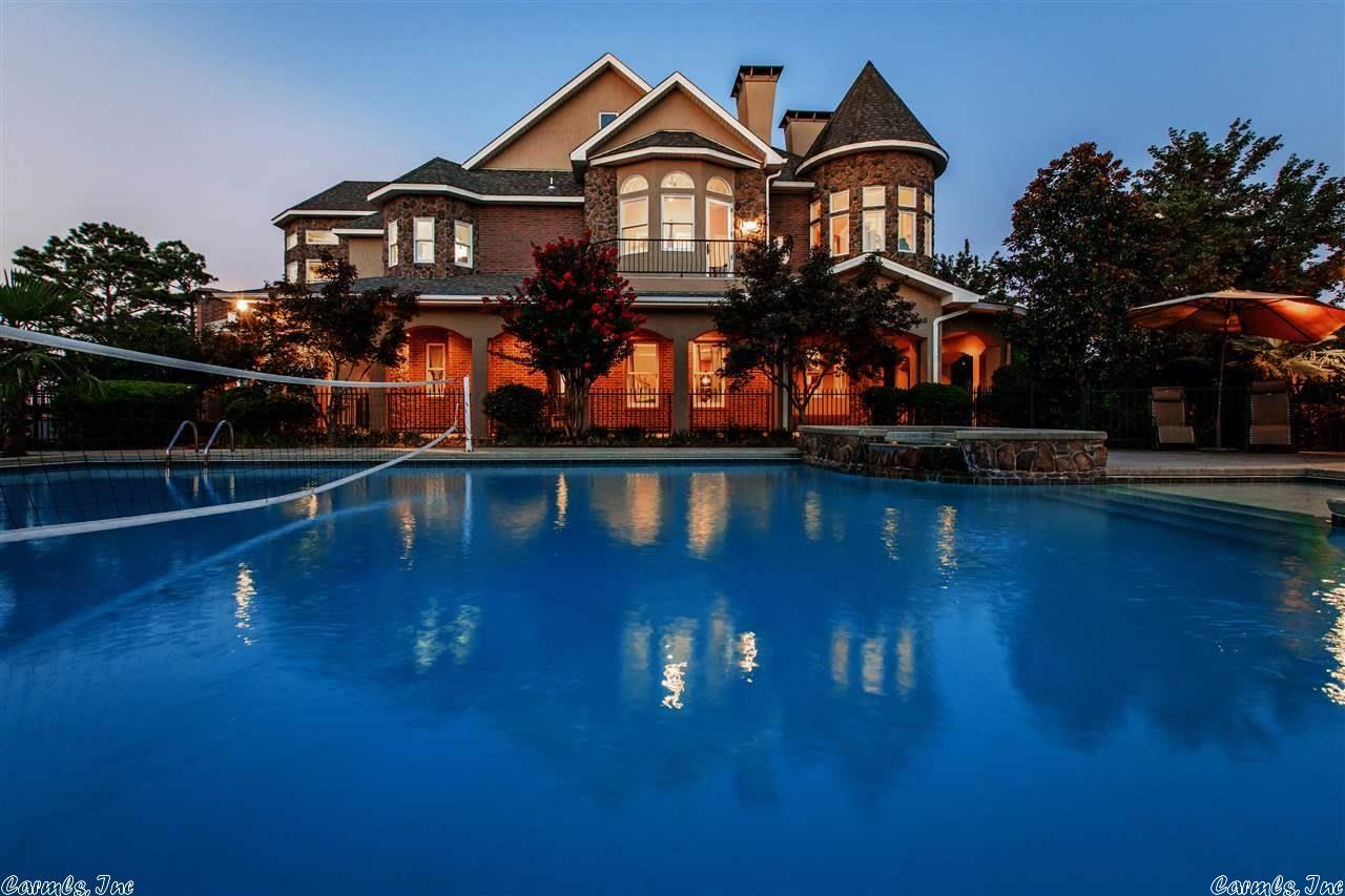 **Room in price for Boat Dock to be added**  This luxurious castle on Lake Hamilton is waiting for you! Enter into the 350 year old imported Italian door. Beautifully handcrafted attention to detail is found throughout this five bedroom, five and a half bath home and guest home, with each bedroom containing it's own en suite full bathroom. Theater, office, game room, infinity pool, hot tub, 5 fireplaces, elevator, all geothermal utilities! Dream home