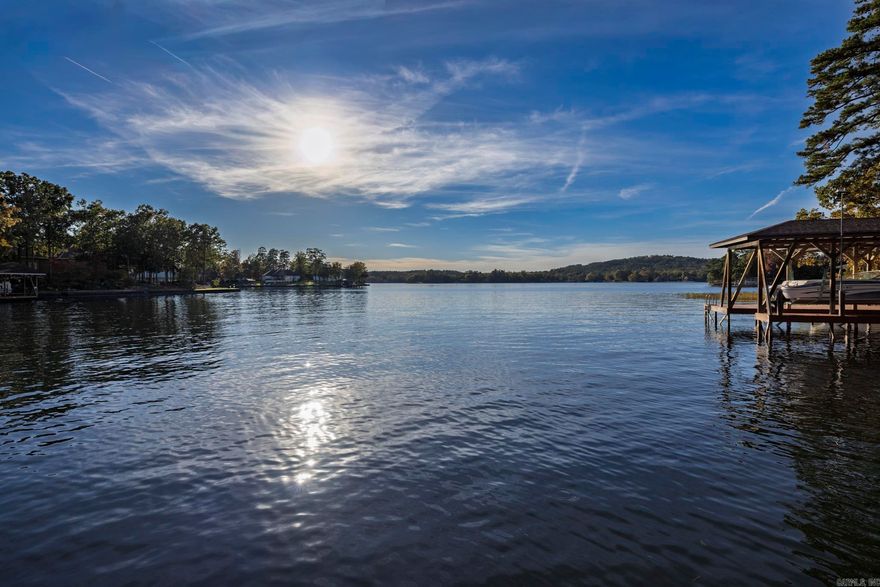 Fabulous custom home with open water views and amazing sunsets on Lake Balboa. Everything you need on one level to be comfortable including 3 beds and two baths.  A  large chefs kitchen includes a generous walk in pantry. Private Primary with a good flow . An amazing guest space with its own kitchenette  bed, bath and rec space including views just as lovely as the main level.  Several flex spaces to accommodate hobbies or special needs. Over sized garage, multiple decks and patios and a  covered boat dock with lift. Waterfall feature on path to lake.  Schedule your tour today!