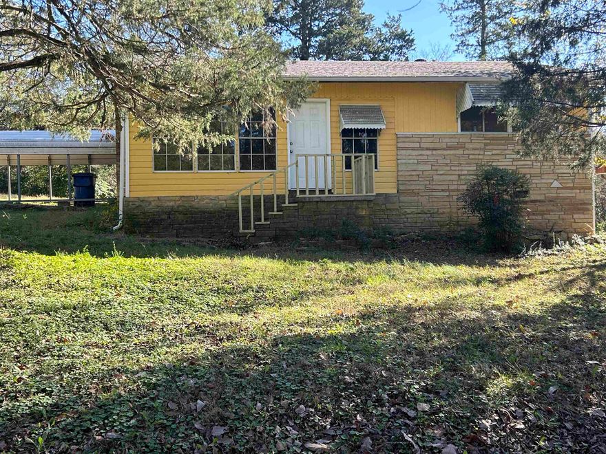 Avail immediately. Spacious 2 Bedroom 1 Bath with bonus (sun) room.  Walk-in closet, Large eat-in kitchen with lots of cabinet space. New floor and paint throughout-no carpet.  Large living room with wood-burning fireplace.  New Central H/A. Two-car metal carport. Storage room or work shop. Covered patio - all on a corner lot. Each adult (18+) is required to complete an application. Credit and criminal background checks. $36 is added to rent to cover pest control, liability insurance & credit reporting services.